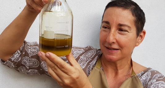 AYA Natural Skin founder testing raw fermented papaya extract during early balm formulation - South African natural skincare brand