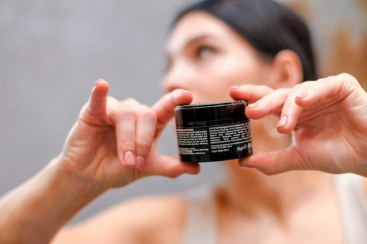 Woman reading natural skincare product label - greenwashing in skincare South Africa