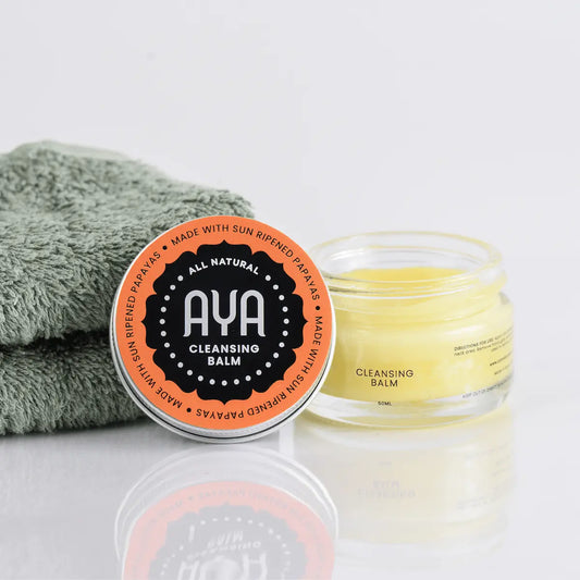 AYA Cleansing Balm 50ml open jar showing natural papaya balm texture with face cloth